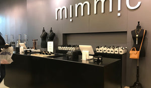 Register counter of Mimmic physical store location, with two ipad registers, and pre-made Mimmic takeout boxes in the background.