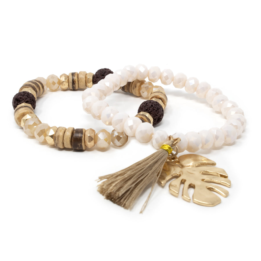 Gold Tone Set of Two Stretch Bracelets With Tassel and Leaf Charm Cream - Mimmic Fashion Jewelry
