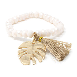 Gold Tone Set of Two Stretch Bracelets With Tassel and Leaf Charm Cream - Mimmic Fashion Jewelry