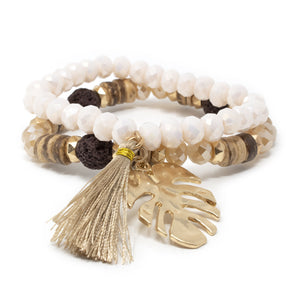 Gold Tone Set of Two Stretch Bracelets With Tassel and Leaf Charm Cream - Mimmic Fashion Jewelry