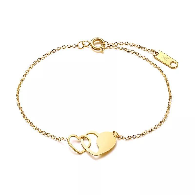 Stainless Steel Bracelet with Interlock Hearts Gold Plated